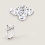 3.25ct Oval Cut Center  with 1.2 Pear-shaped stones on the sides. Center stone size: 12x7.75mm F321-CZ-14K