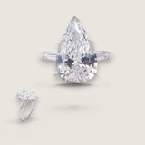8ct Pear-shape Center Ring  with .50ct Baguettes on the sides. Center stone size: 17x11mm.