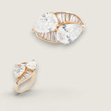 Twist Ring with 2 Pear-Shaped stones in the center of 6 TCW  surrounded by Baguettes of 1 TCW.  F242-CZ-14K