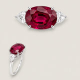 7ct Oval Cut Center  with 2 Pear-Shaped stones on the sides of 4.4 TCW. Center stone size: 14x10mm  F122-RUB-CZ-14K