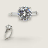2.25ct Round Cut Center with .5ct Tapered Baguette Cut stones on the sides. Center stone size: 8.5mm 1783-4-CZ-14K