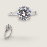 2.5ct Round Cut Center with .5ct Tapered Baguette Cut stones on the sides. Center stone size: 9mm 1783-5-CZ-14K