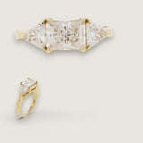 1.5ct Emerald Cut Center with .8ct Trillion cut stones on the sides. Center stone size: 8x6mm 17565-CZ-14K