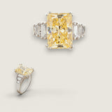 5.5ct Canary Emerald Cut Center with 6 Baguette Cut stones of .9ct on the sides. Center stone size:12x8.5mm