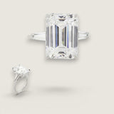 9ct Emerald Cut Center with .5ct Baguette Cut stones on the sides. Center stone size: 14x10mm