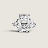 9ct Emerald Cut Center with 1.1ct Trillion Cut stones on the sides. Center stone size: 14x10mm 17162T-CZ-14K