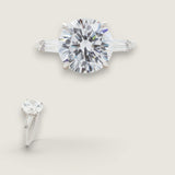 4ct Round Cut Center with .5ct Baguette Cut Stones on the sides. Center stone size: 10.5mm 17158-8-CZ-14K
