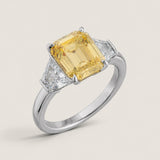 Emerald-cut Canary with Trapezoid Side Stones