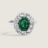 2.5ct oval ctr. surr. by 10 rds.  T13092-EM-CZ-14K