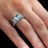 Wide Shank 3.5ct Emerald Cut Aquamarine Center with 2 Emerald Cut stones of 2ct on the sides.