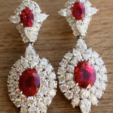 OVAL TOP SURR BY ROUND W/ LARGE OVAL BTTM SURR BY ROUNDS