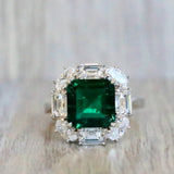 Emerald Cushion Cut Center with Oval and Baguette Halo Ring (5.6 TCW)
