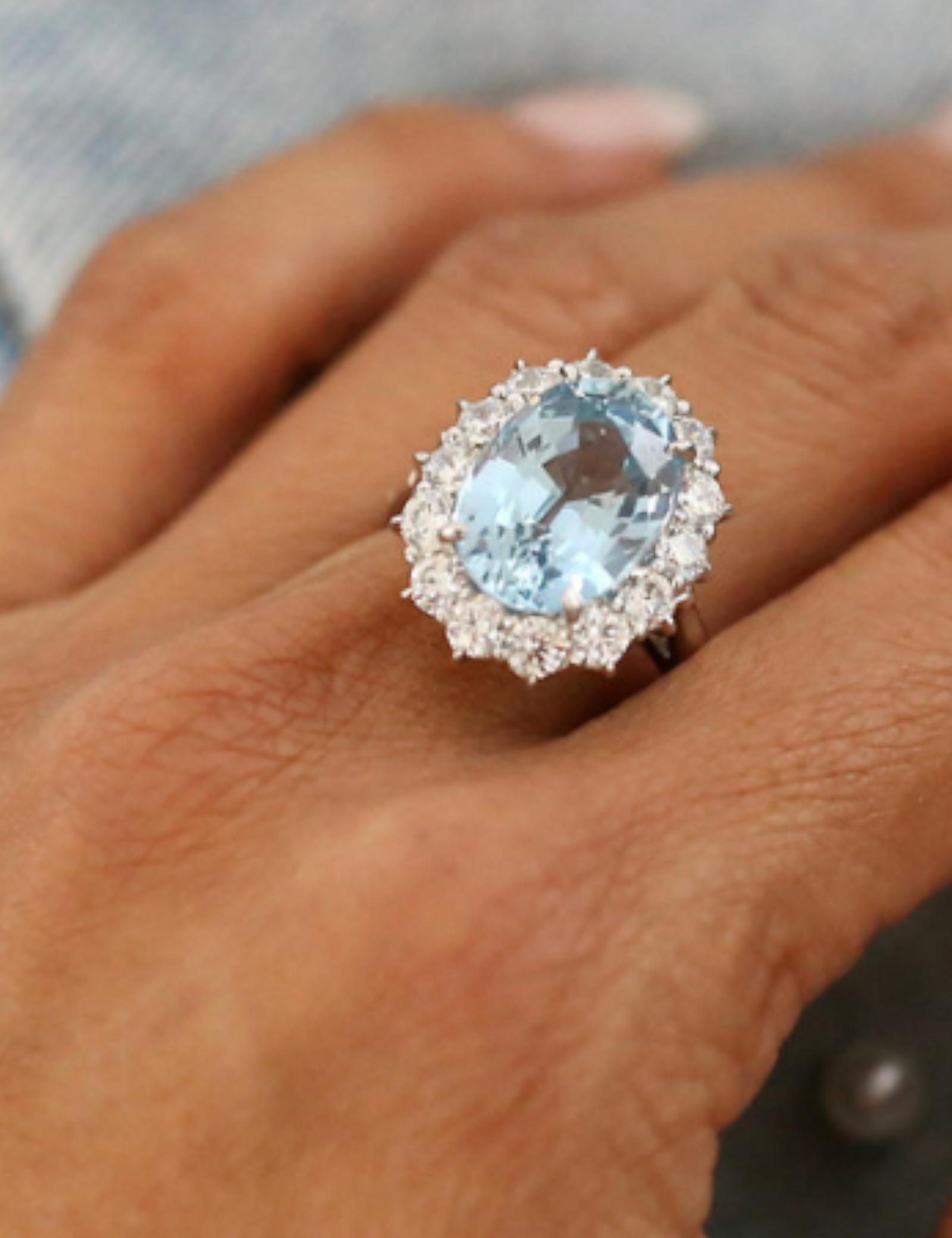 Oval Aqua Center Ring in a Halo Setting