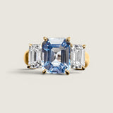 Wide Shank 3.5ct Emerald Cut Aquamarine Center with 2 Emerald Cut stones of 2ct on the sides.