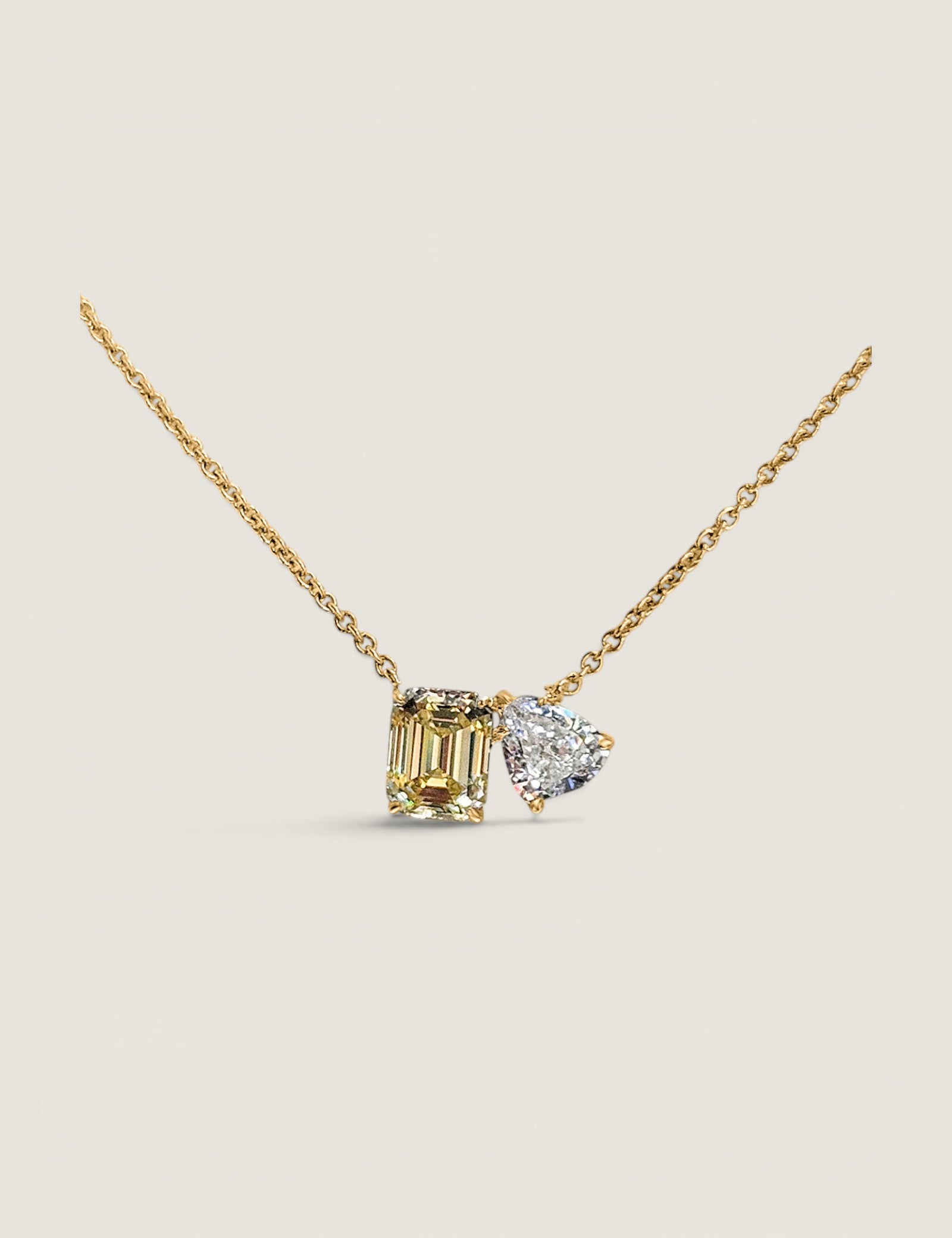 Toi et Moi Pendant. 1.5ct(9x7)Canary Emerald and 1.25ct (8x7) Pear shape on 16" chain.